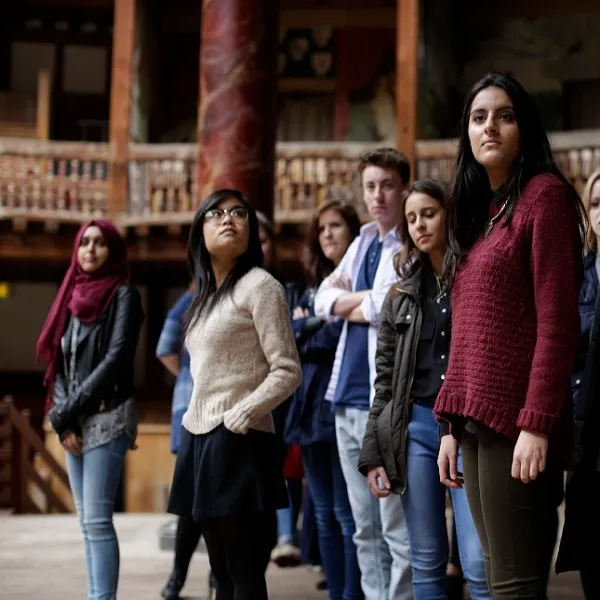 group of students on stage at Shakespeare's Globe