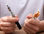 Cigarette and an e-cigarette. Credit: Andrey_Popov