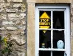 A stop Brexit sign in the window of a village house