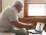 Elderly man receiving assistance during isolation