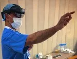 Professor Shafi Ahmed using smart glasses on his ward visits