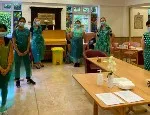 Queen Mary staff and student volunteers at a care home