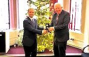 Prof Sir Mark Caulfield is presented with Kuwait medal