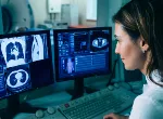 Radiologist reading a CT scan. Credit:peakSTOCK/iStock.com