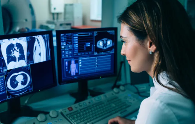 Radiologist reading a CT scan. Credit:peakSTOCK/iStock.com