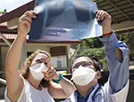 Jess and Dr Chhim examine a TB patient's X-ray at Kampong Cham hospital, Cambodia. Credit: Tom Maguire/RESULTS UK