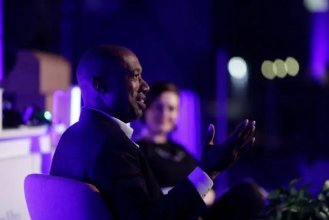 Gavin Lewis speaking on stage
