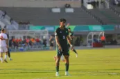 Imran Kayani playing football on a pitch