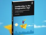 Book cover with a man standing on a yellow kite in a blue sky