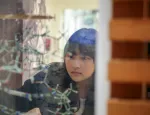 Student looking at molecular structure through glass