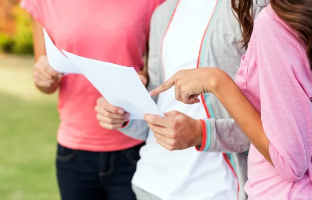 Students receiving results. Credit: Istock.com/Neustockimages
