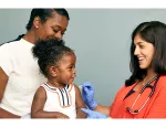 Child about to receive a vaccine from a doctor. Photo credit Flickr