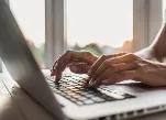 Person typing on laptop computer keyboard.Credit:Poike/iStock.com