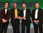 Ben Burns and Prof Jonathan Pitts (centre left and right) from Actual Experience accepting the award for Innovation and Entrepreneurship at the UK IT Industry Awards.