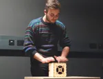 Classical guitarist Michael Poll tries out the experimental digital music cube 