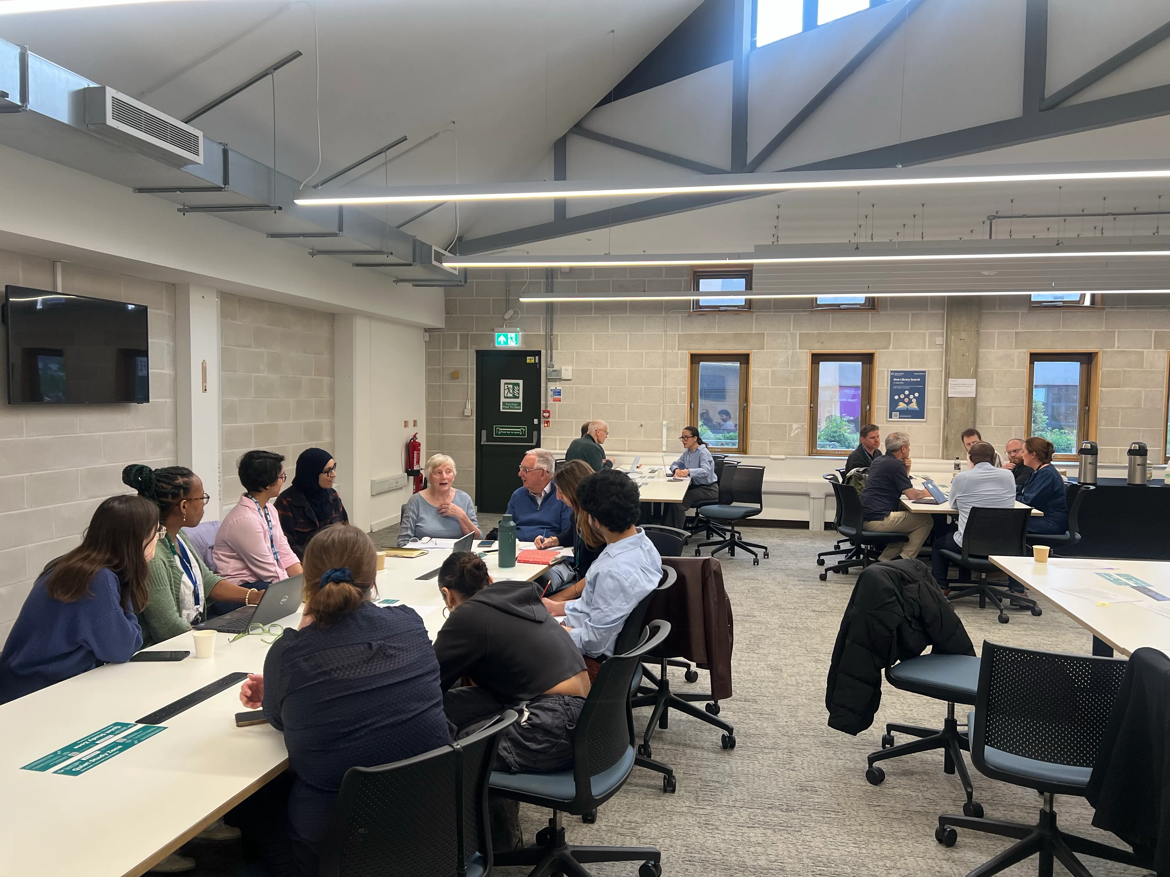 Group discussions around tables at the annual East London Research Network and TELCO meeting