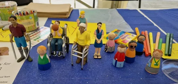 Small models of people on a table