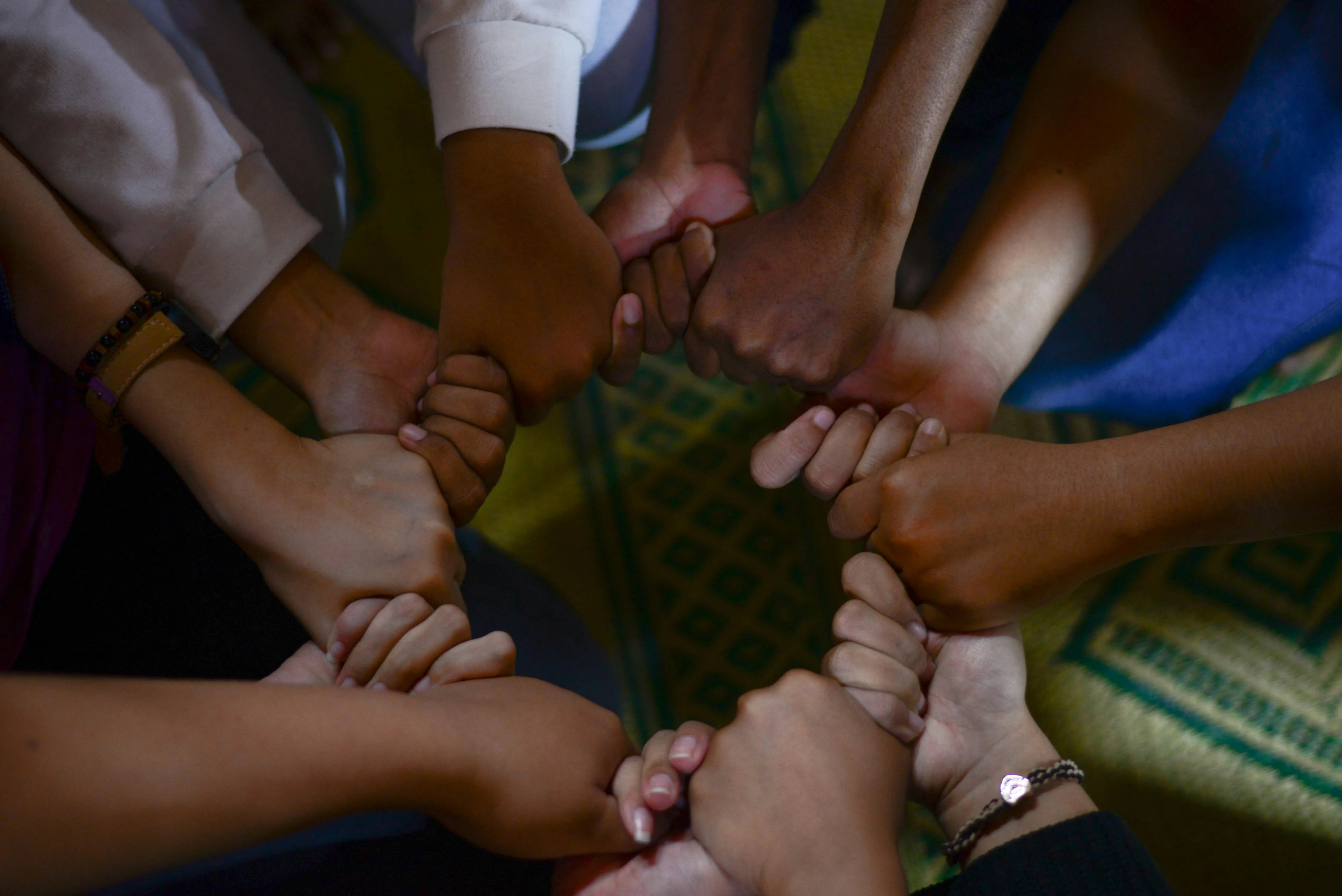 A circle of peoples hands