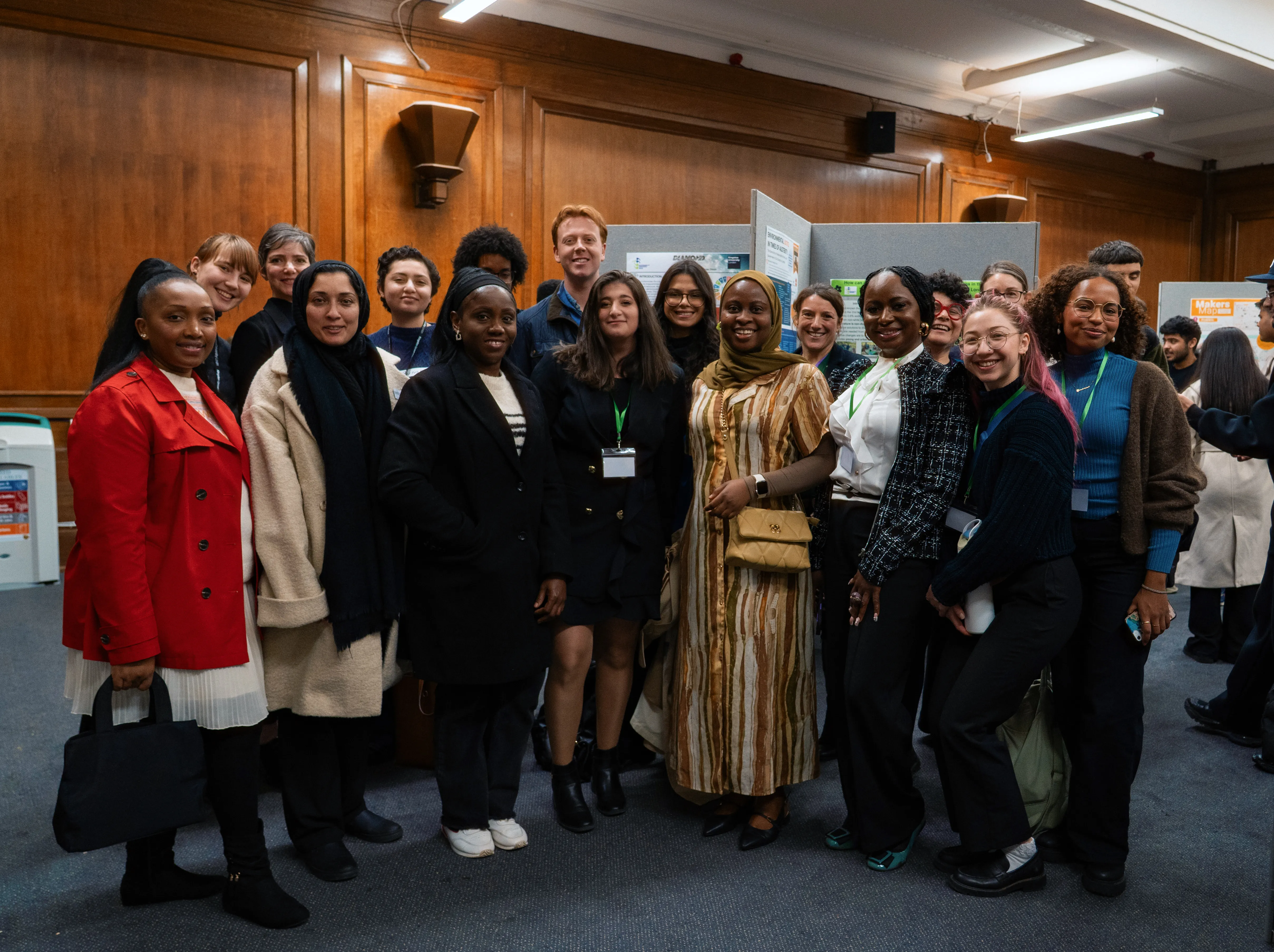 A group of student presenters gathered at the poster exhibition