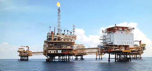 An oil rig in the ocean.
