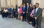 Professor Rosa Lastra and Dr Daniele D'Alvia with Queen Mary LLM students standing by a door to the Bank of England.