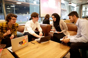 Group of students working on their QConsult project