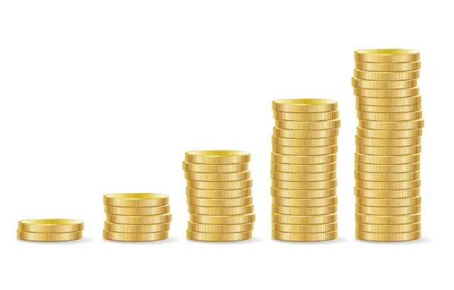 Piles of coins increasing in height to represent mounting debt