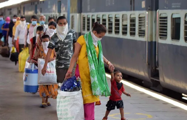 Migrants from Mumbai arrive by a special train at Prayagraj Junction during a national coronavirus lockdown in May 2020
