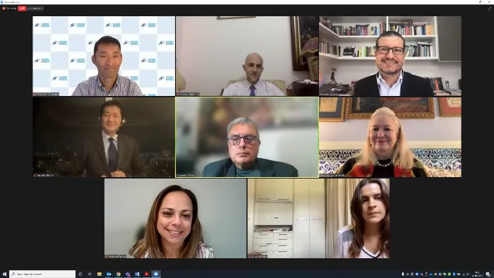 The panel smiles at the camera