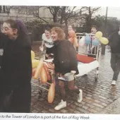 1974 Students in Rag Week pushing a wheeled bed with balloons