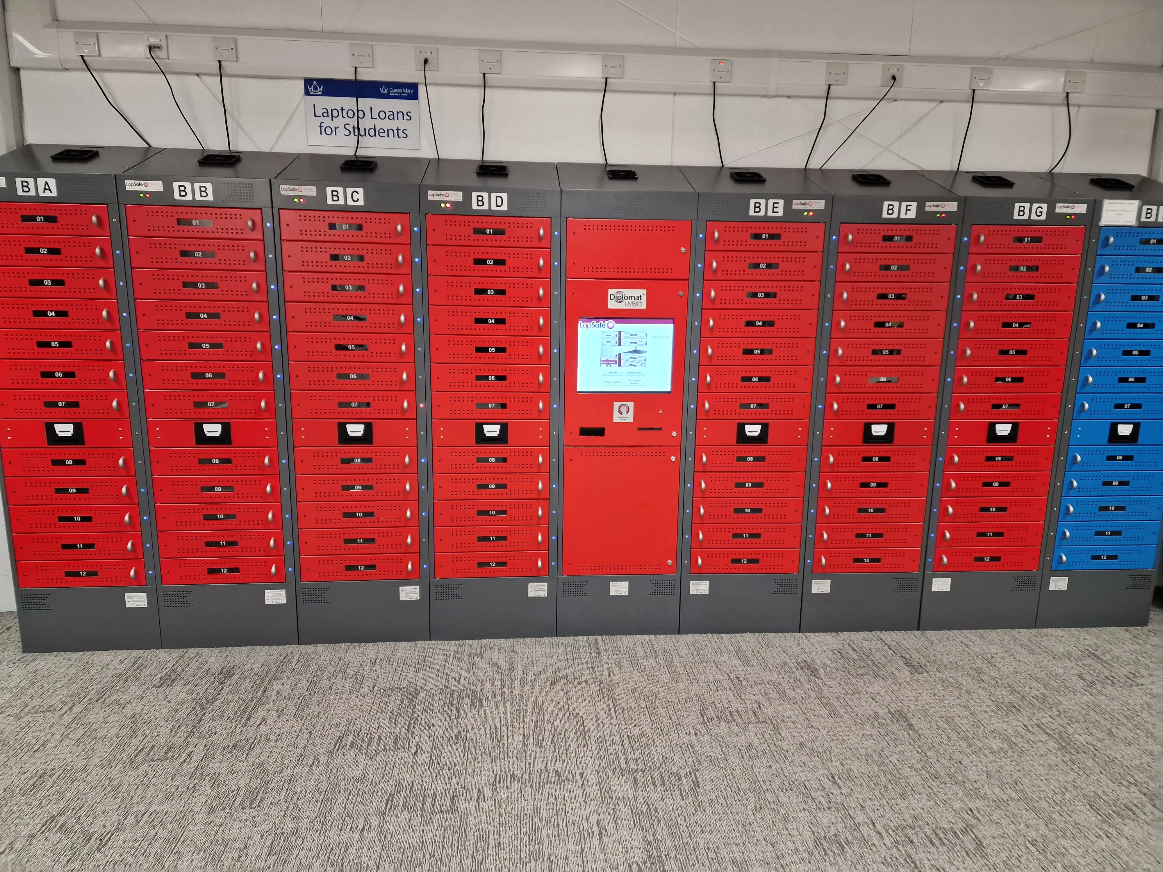 Red lockers for laptops at Mile End Library