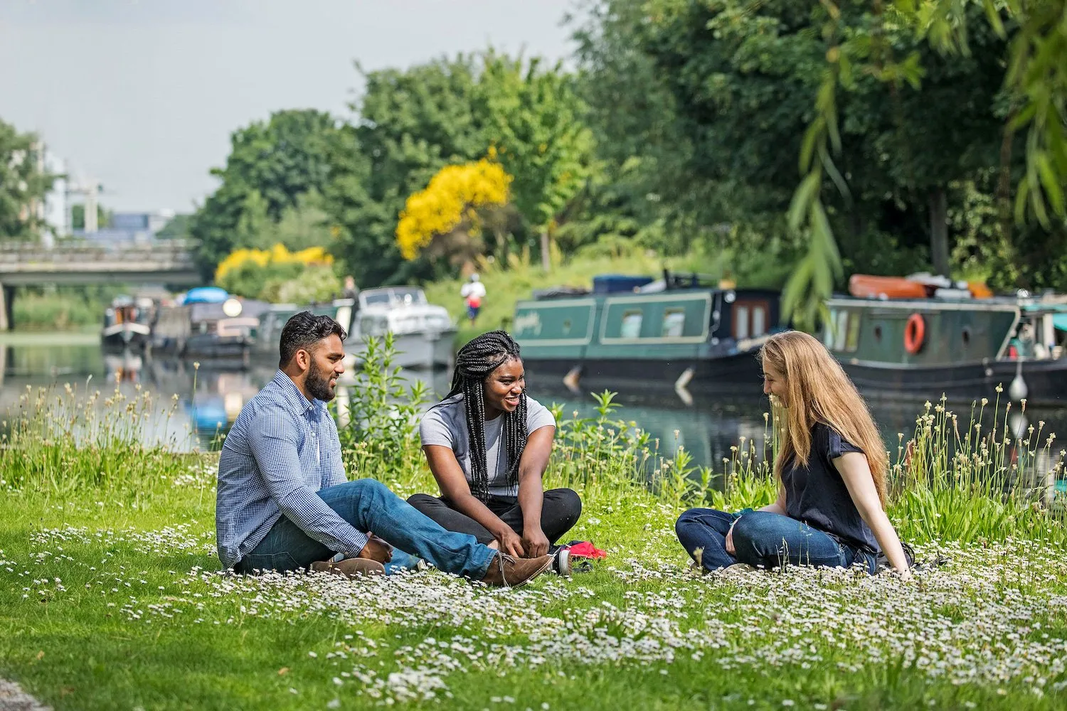 Students chatting on Mile End Campus by Regents Canal
