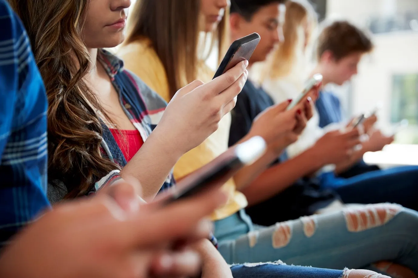 Photo of young people with phones
