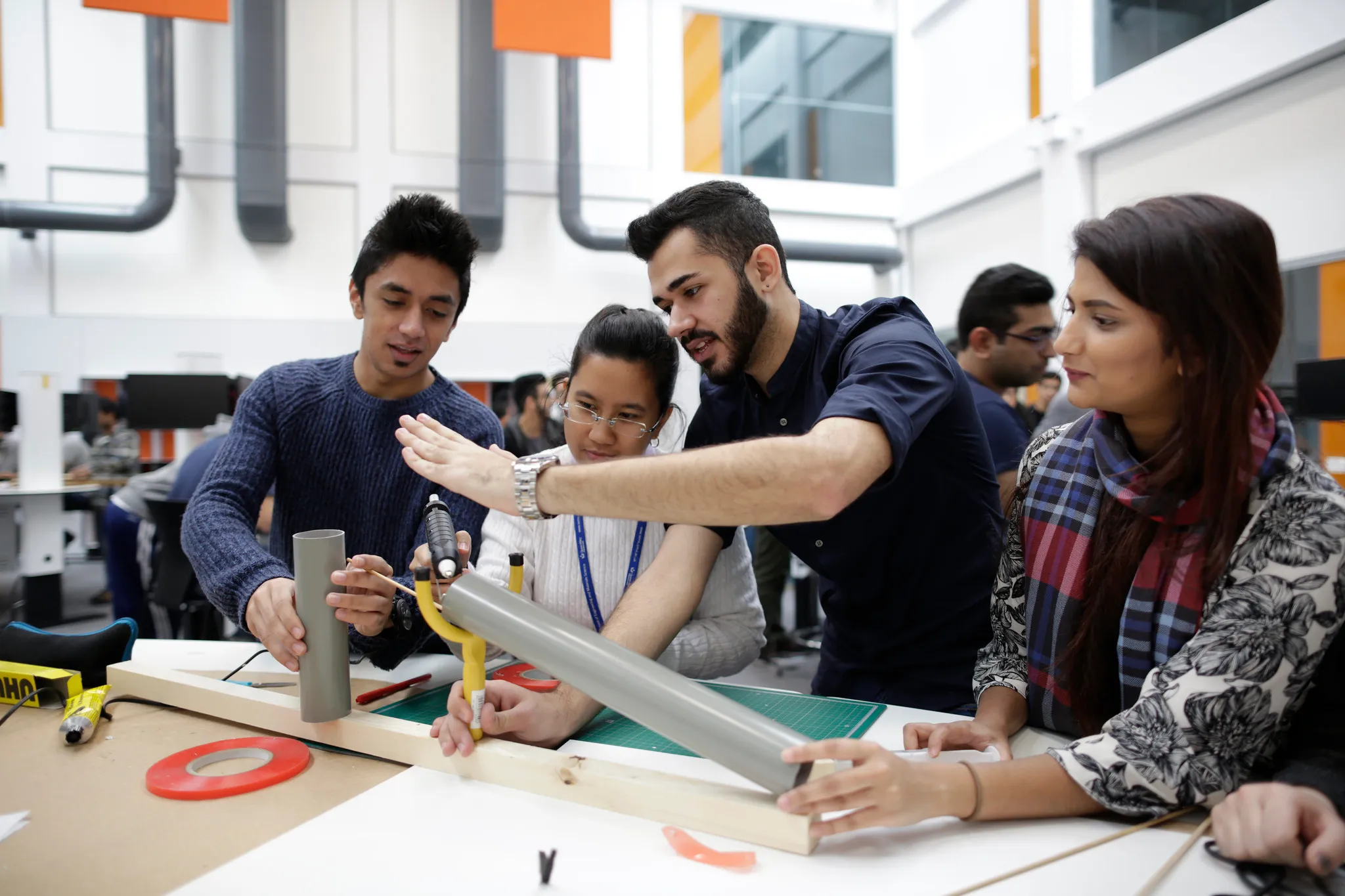 Teacher and students in a workshop