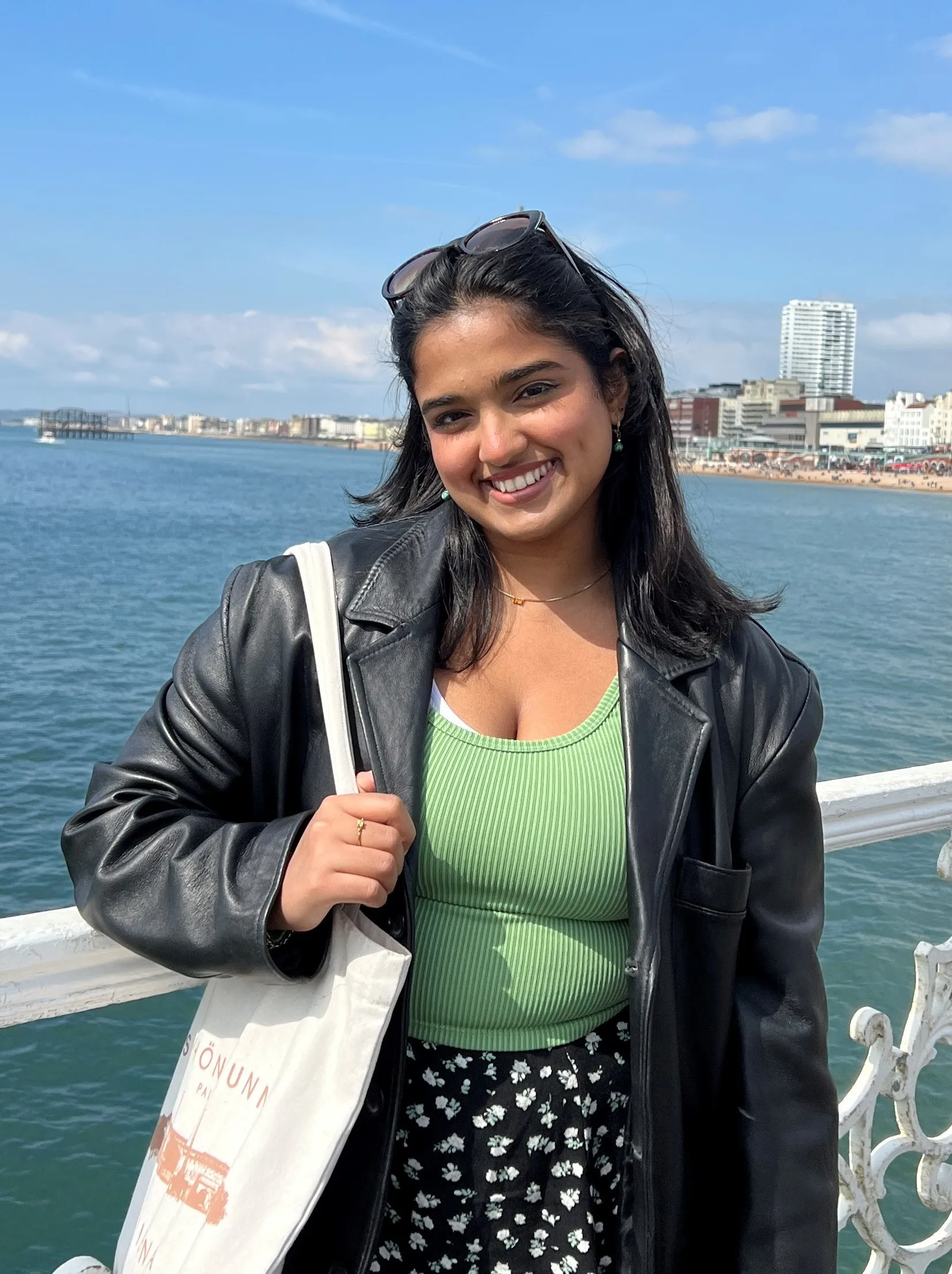 Vandy - TEL Student Ambassador with the sea in the background.