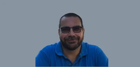 A picture of Prof Nikos Lemos against a grey background