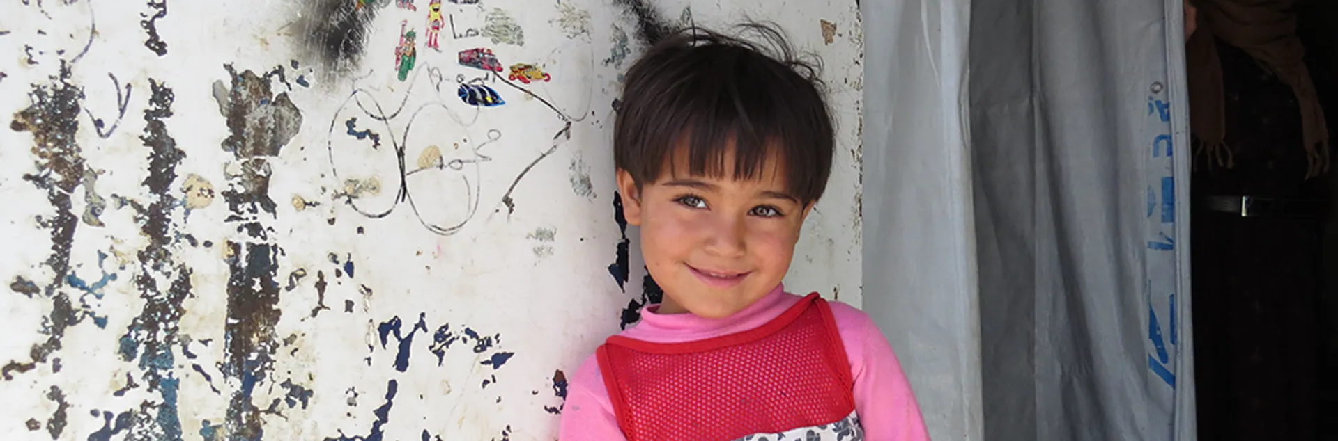 Smiling child refugee