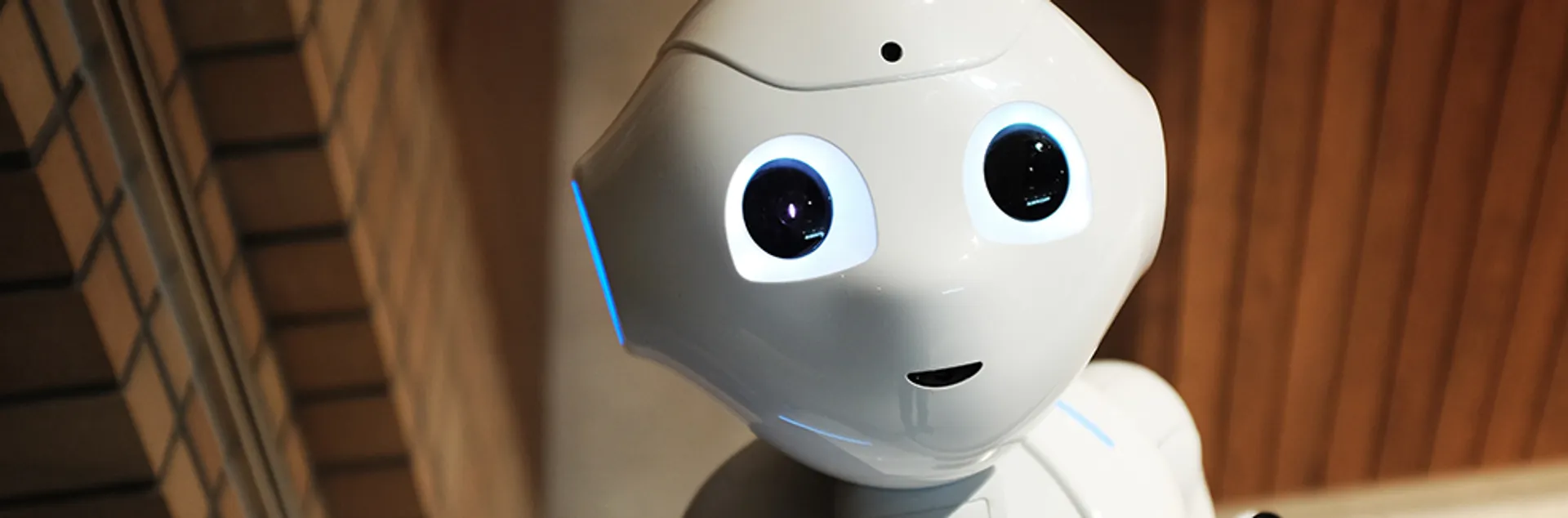 a smiling white robot