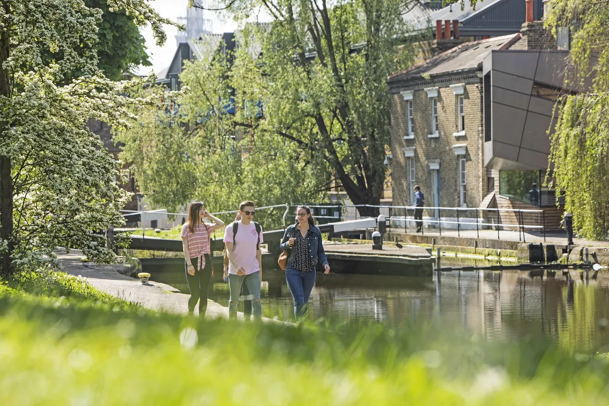 Students walking by canal