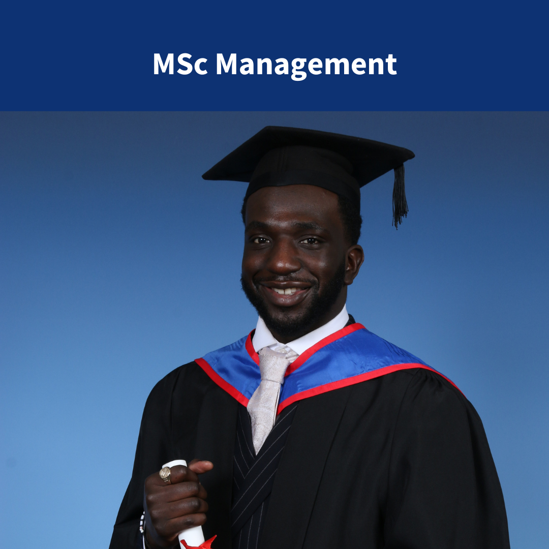 An image of a graduate in cap and gown holding a scroll
