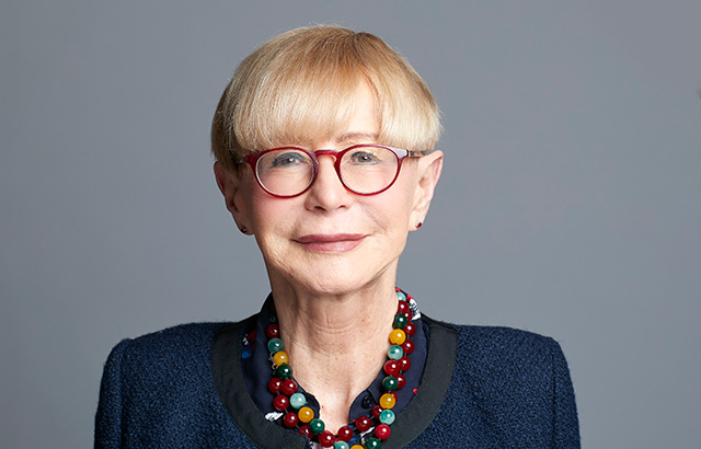 Malgosia Fitzmaurice wearing a nazy jacket and glasses.