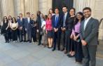 Professor Rosa Lastra and Dr Daniele D'Alvia with Queen Mary LLM students standing by a door to the Bank of England.