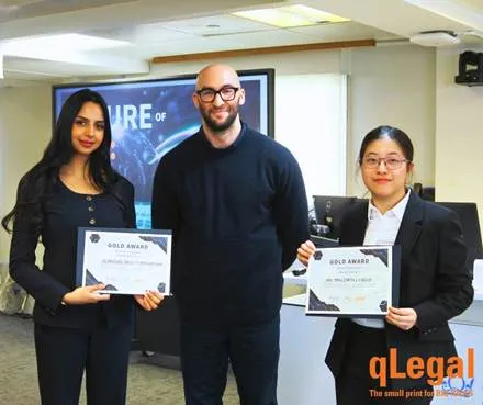 qLegal students with their AI Talks competition awards.