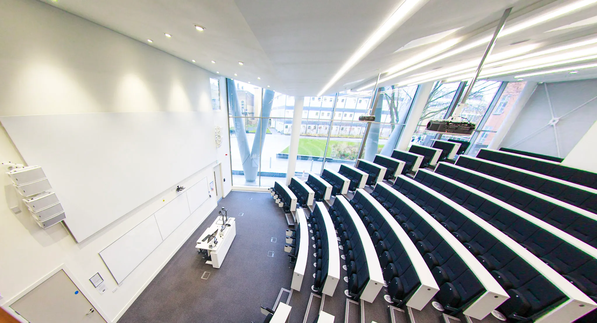 Image of Peston Lecture Theatre taken from the front at right side. Giving a side view of space.